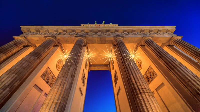 Brandenberg Gate, lit up, portraying a structure of splendour.