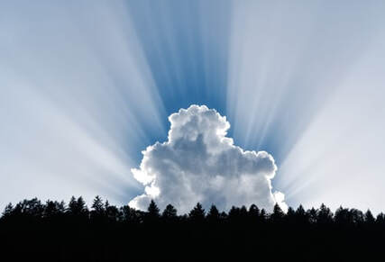 Sunrays shining behind cloud, illustrating the idea of ‘every spiritual blessing’.