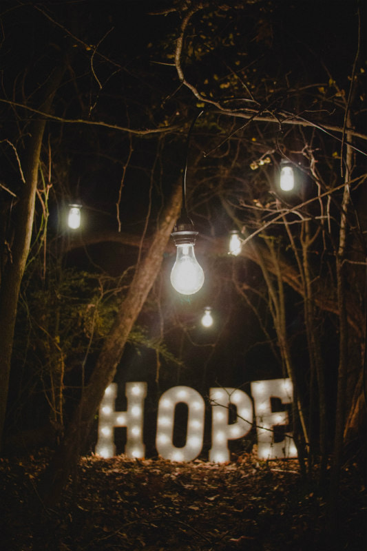 Garden lights and 'hope' neon sign illustrating 'A hope filled year'.