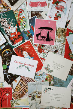 Assorted Christmas cards, with a nativity scene standing out.