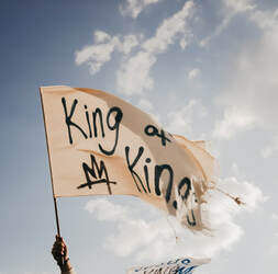 Flag saying 'King of Kings'.