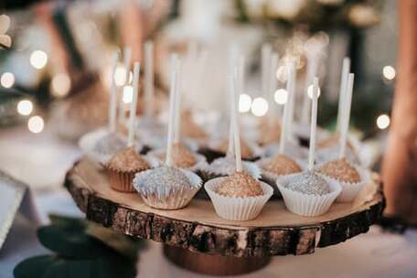 Mini cupcakes, sparkling with lit candles, illustrating the section on ‘Spirit-filled Festival’.