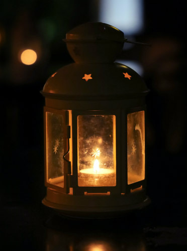 Lantern dispelling darkness, illustrating blog theme.