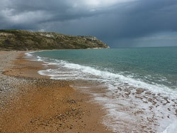 Sea-washed shore, picture link to 'The Grace of Baptism'.