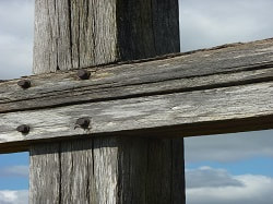 Close up of an empty cross, picture link to ‘The Power of the Cross’ page.