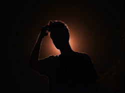 Silhouette of person in quizzical posture, picture link to ‘Who am I really?’ page.