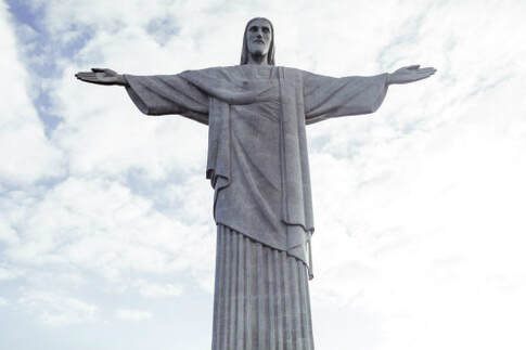 Statue of Jesus, with outstretched arms, illustrating his invitation to ‘enter his rest’.