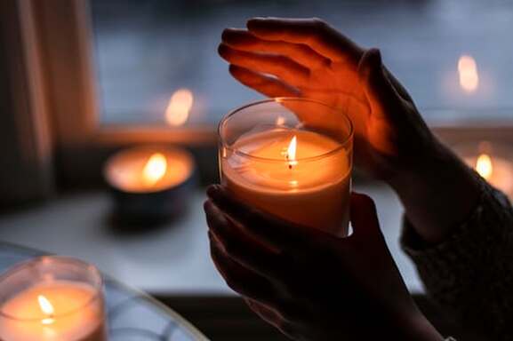 Person holding a candle illustrating the blog theme, 'grace-filled encounter'.