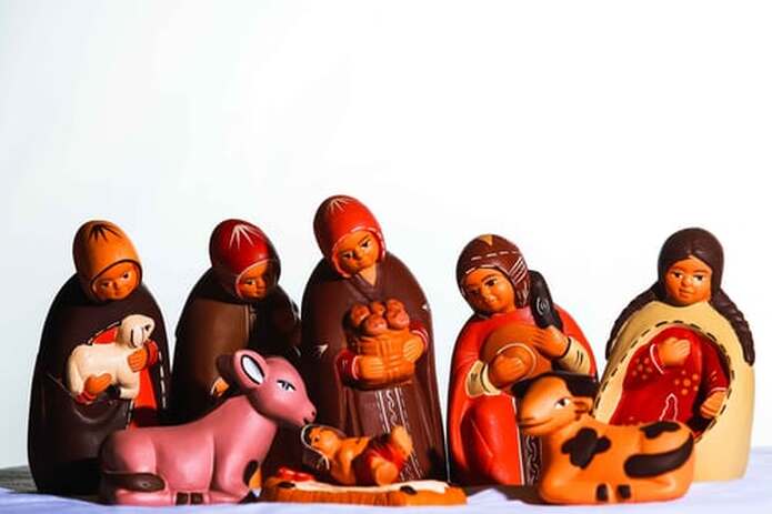 Nativity scene with figures in Peruvian traditional dress.