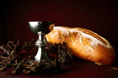 Bread, wine and a crown of thorns, a reminder that Jesus broke bread with the disciples on the road to Emmaus.