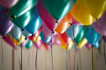 Close-up of many helium-full balloons, illustrating the idea that Spirit-filled ‘party’ is in the heart of God.