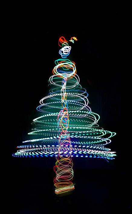 Christmas tree drawn with swirling lights.