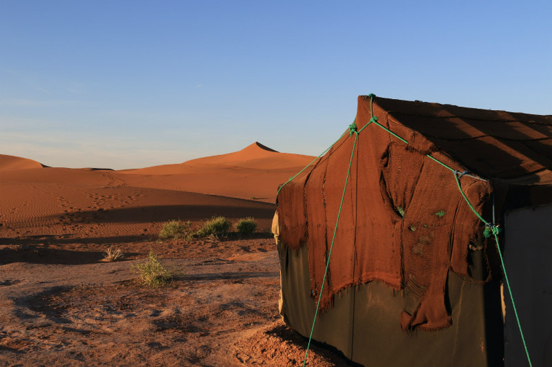 Nomad's tent with a desert outlook.